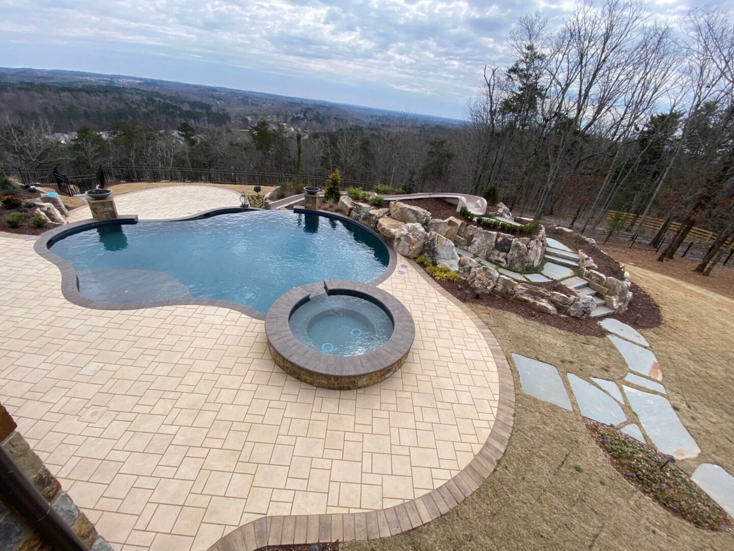 ariel view of pool hot tub combo