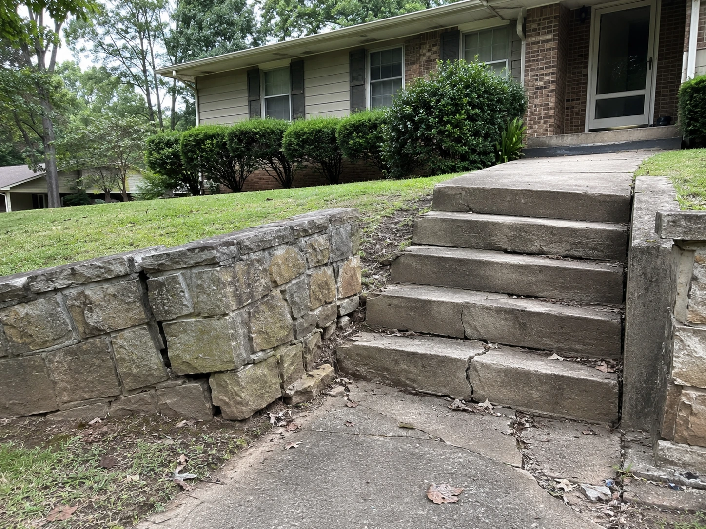Cracked front steps on a 1970s home near Old National Highway in South Fulton