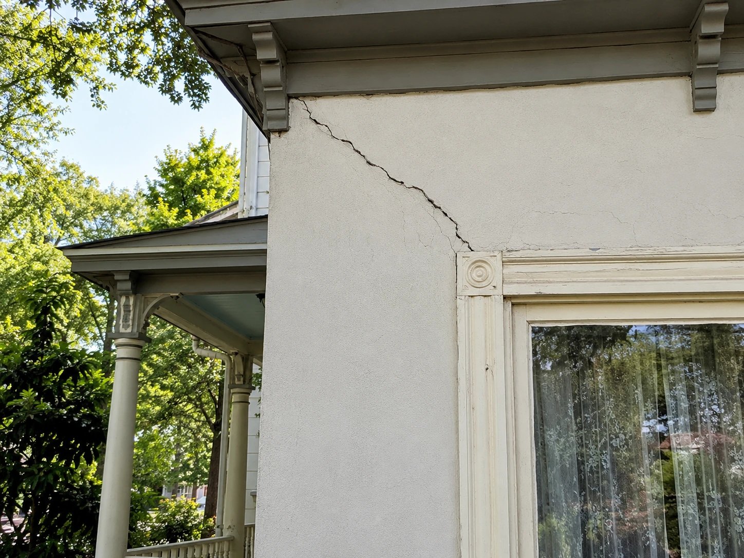 Diagonal crack above a window on a Historic College Park district home