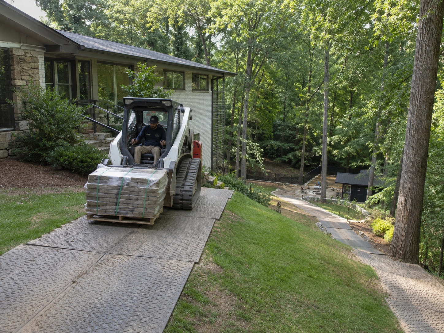 Stone moved down a protected path on a sloped Adamsville lot