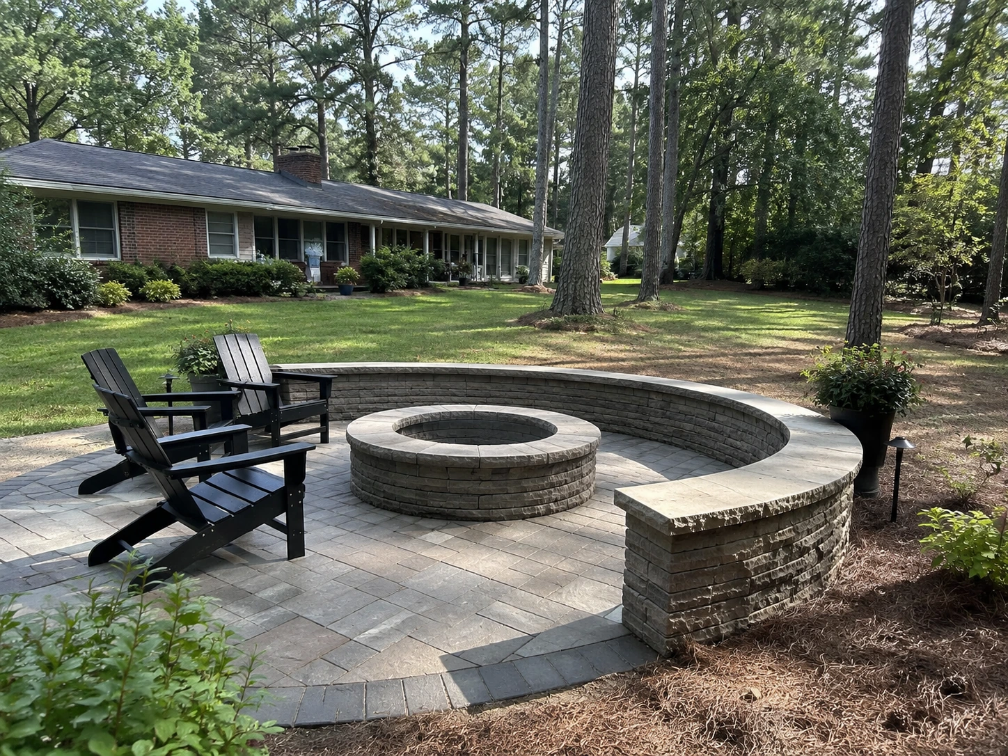 Stone patio and seat wall in a large North Decatur back yard