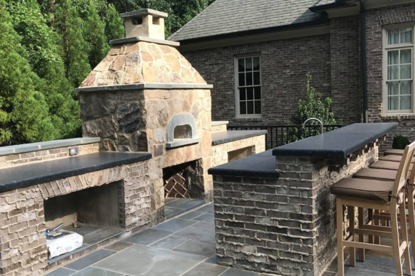 Outdoor Kitchen with Stone Fireplace